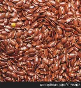The flax seeds as a background close up. flax seeds