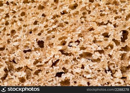 The flesh of fresh bread. Macro background. The texture of the bread. High quality photo. The flesh of fresh bread. Macro background.