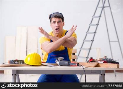 The floor repairman disappointed with his work . Floor repairman disappointed with his work
