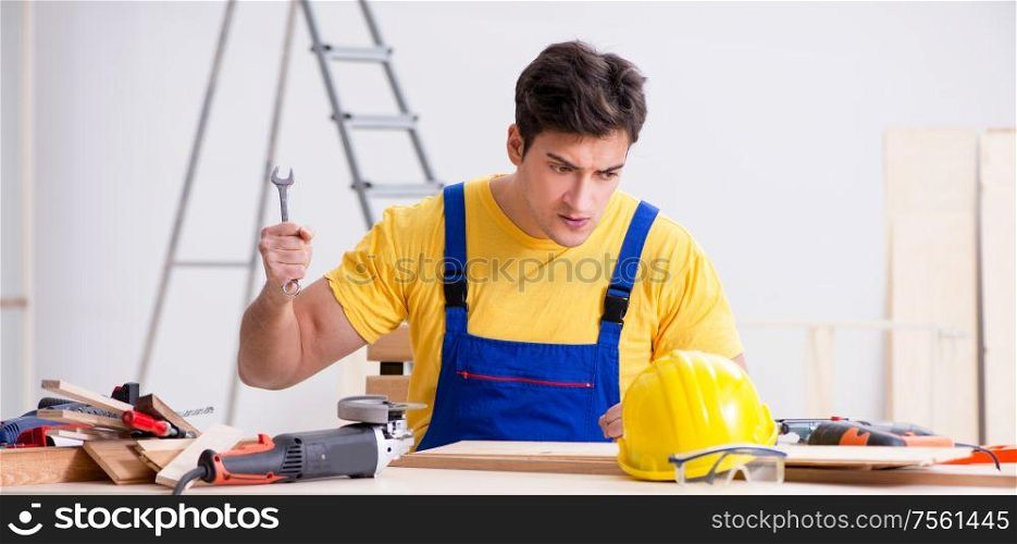 The floor repairman disappointed with his work. Floor repairman disappointed with his work