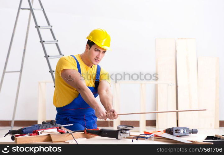 The floor repairman disappointed with his work. Floor repairman disappointed with his work