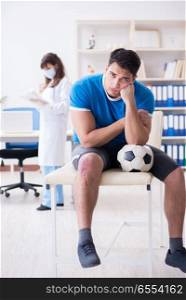 The football soccer player visiting doctor after injury. Football soccer player visiting doctor after injury