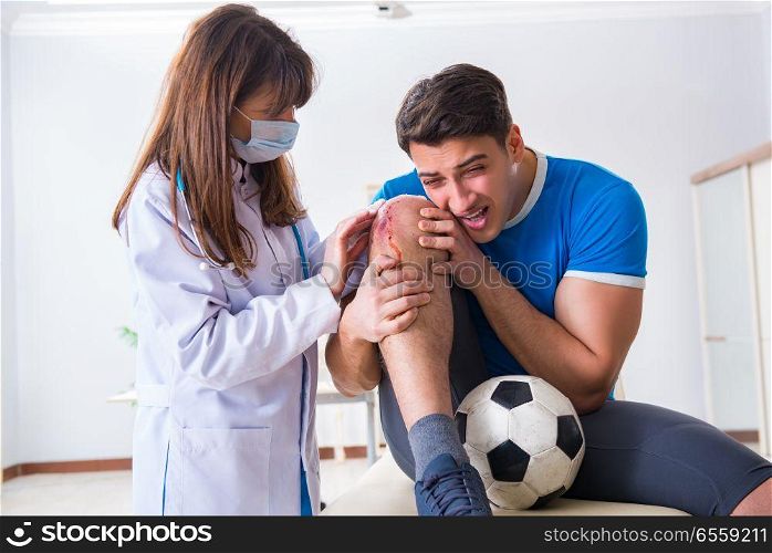The football soccer player visiting doctor after injury. Football soccer player visiting doctor after injury