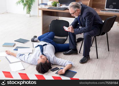 The forensic investigator and dead employee in the office. Forensic investigator and dead employee in the office