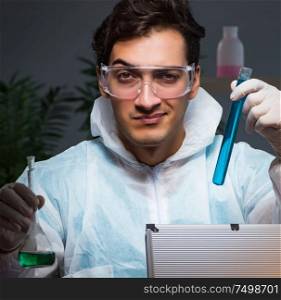 The forensic investigator working in lab looking for evidence. Forensic investigator working in lab looking for evidence