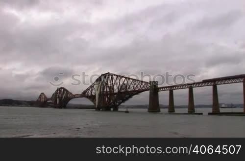 "The Forth Bridge is a cantilever railway bridge over the Firth of Forth in the east of Scotland, to the east of the Forth Road Bridge, and 14 kilometers west of central Edinburgh. It is often called the Forth Rail Bridge or Forth Railway Bridge to distinguish it from the Forth Road Bridge. Described as "the one internationally recognised Scottish landmark"."