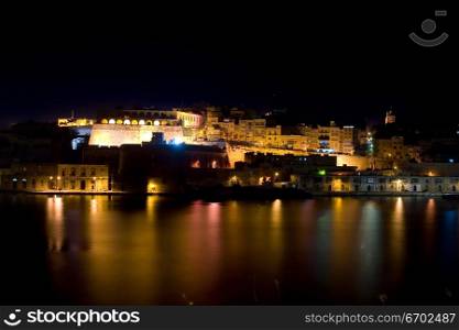 The forts of Valetta at night in Malta.