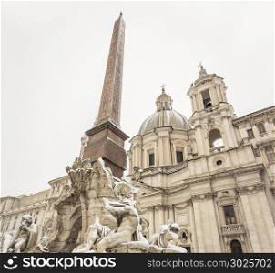 the fountain of the four rivers and the facade of the church of saint agnese in piazza Navona in Rome covered with snow after the unusual snowfall of February 26th 2018