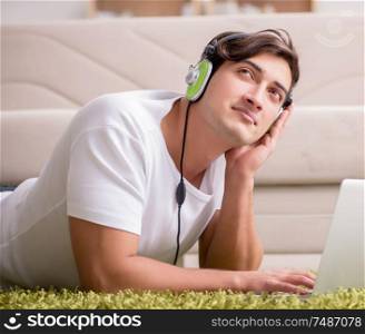 The freelancer working at home and listening to music. Freelancer working at home and listening to music