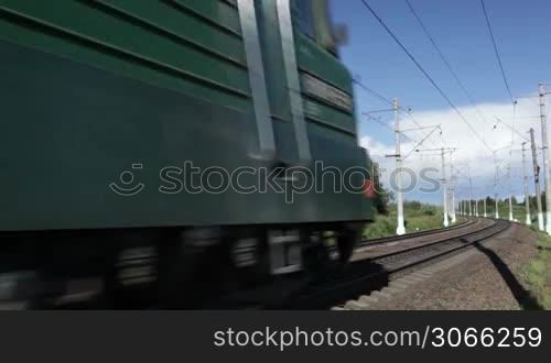 the freight train is passing by on a sunny day. middle shot with polarizer.