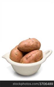 The fresh agricultural product known as the sweet potato.