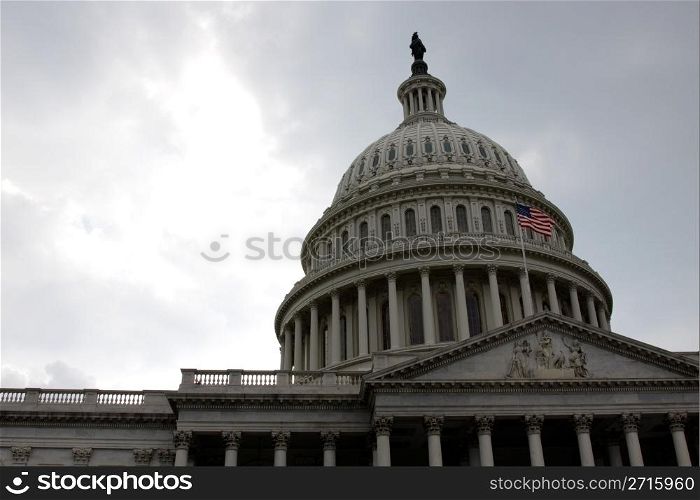 The front of the United States Capitol building, in Washington D.C., against stormy cloud.. Front of the Capitol Building