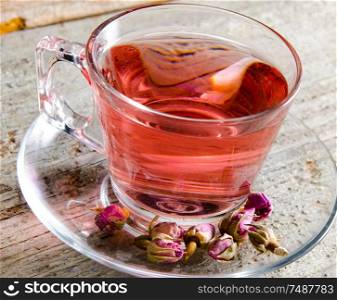 The fruit berry tea in the cup served on table. Fruit berry tea in the cup served on table