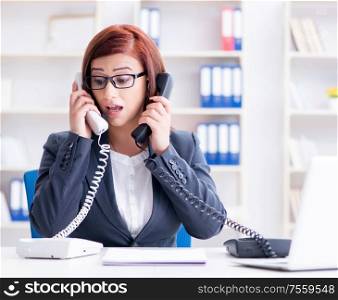 The frustrated call center assistant responding to calls. Frustrated call center assistant responding to calls