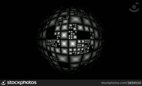 The full-sphere with pyramids rotates on a black background