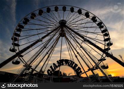 The fun park silhouette with sunset sky