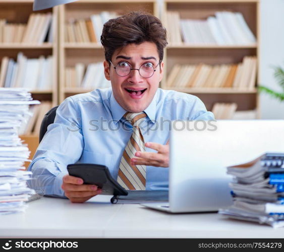 The funny accountant bookkeeper working in the office. Funny accountant bookkeeper working in the office