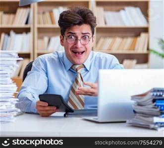 The funny accountant bookkeeper working in the office. Funny accountant bookkeeper working in the office