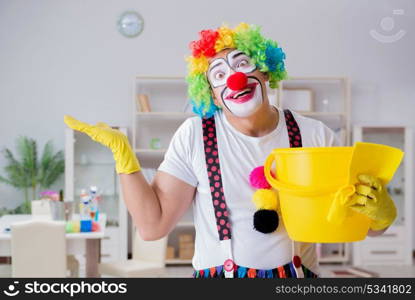 The funny clown doing cleaning at home. Funny clown doing cleaning at home