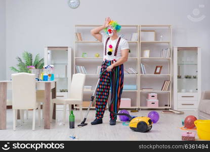 The funny clown doing cleaning at home. Funny clown doing cleaning at home