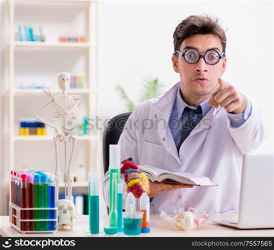 The funny doctor having fun in hospital lab. Funny doctor having fun in hospital lab
