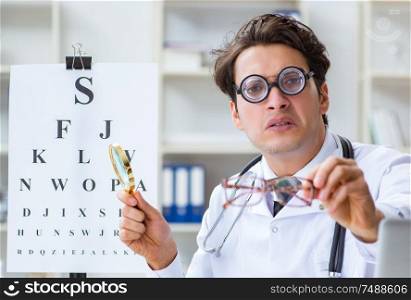 The funny eye doctor in humourous medical concept. Funny eye doctor in humourous medical concept