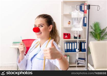 The funny female doctor working in the clinic. Funny female doctor working in the clinic
