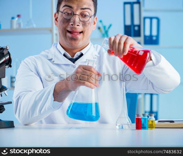 The funny mad chemist working in a laboratory. Funny mad chemist working in a laboratory