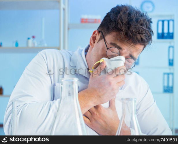 The funny mad chemist working in a laboratory. Funny mad chemist working in a laboratory