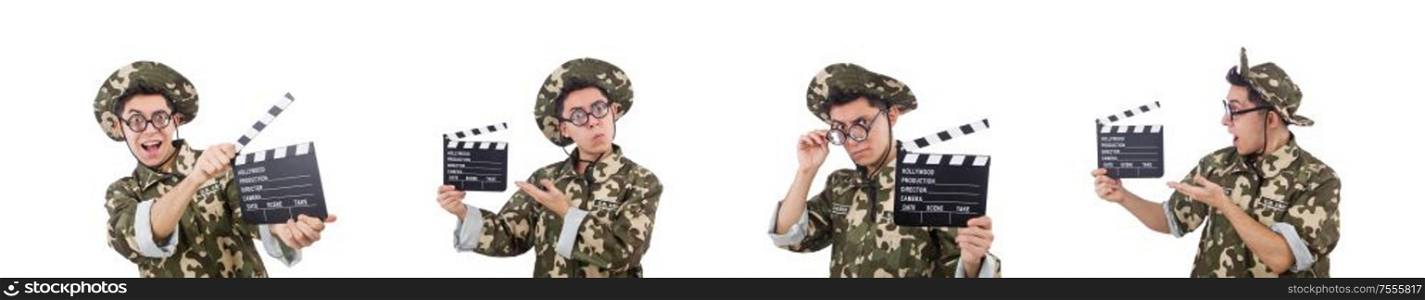 The funny soldier with movie board isolated on the white. Funny soldier with movie board isolated on the white