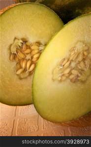 The Galia is a type of hybrid melon originating from a cantaloupe-honeydew cross, larger than a canteloupe, and with deep greenish yellow flesh.