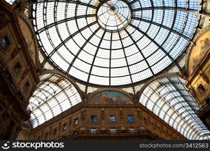 The Galleria Vittorio Emanuele II is a covered double arcade formed of two glass-vaulted arcades at right angles intersecting in an octagon, prominently sited on the northern side of the Piazza del Duomo in Milan.