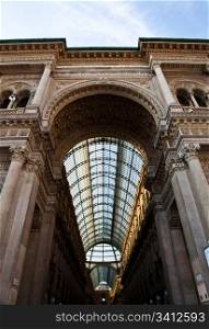 The Galleria Vittorio Emanuele II is a covered double arcade formed of two glass-vaulted arcades at right angles intersecting in an octagon, prominently sited on the northern side of the Piazza del Duomo in Milan.