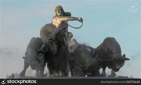 The Gefion Fountain in Copenhagen, Denmark. View to the statue of Norse goddess Gefjun driving bulls on blue sky background