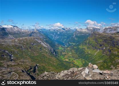 The Geiranger fjord in Norway, surrounded by high mountains