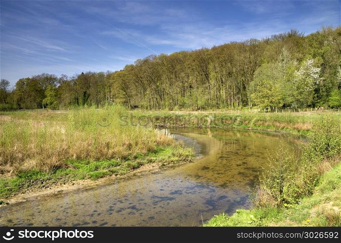 The Geleenbeek in spring atmosphere flowing through the Geleenbeek valley near Schinnen in the Dutch province Limburg. The Geleenbeek river. The Geleenbeek river