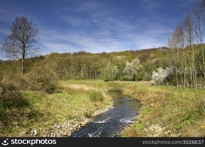 The Geleenbeek river. The Geleenbeek in spring atmosphere flowing through the Geleenbeek valley near Schinnen in the Dutch province Limburg