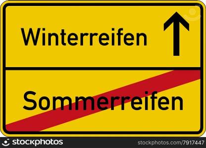 The German words for winter tires and summer tires (Winterreifen and Sommerreifen) on a road sign