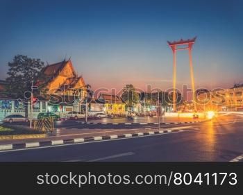 The Giant Swing and Suthat Temple at Twilight Time, Bangkok, Thailand (Vintage filter effect used)
