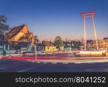 The Giant Swing and Suthat Temple at Twilight Time, Bangkok, Thailand (Vintage filter effect used)