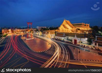The Giant Swing or Sao Ching Cha monument with Wat Suthat temple at night in old town, Bangkok City, Thailand. Landmark tourist attraction. Thai architecture with travel trip concept.