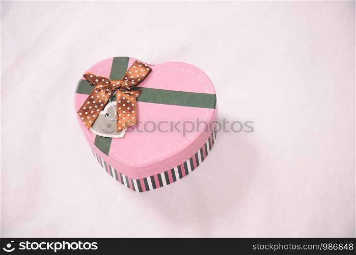 The gift is Packed in Kraft paper place on the bed. Christmas and other gifts.