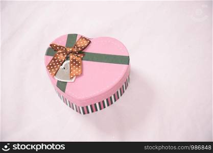 The gift is Packed in Kraft paper place on the bed. Christmas and other gifts.