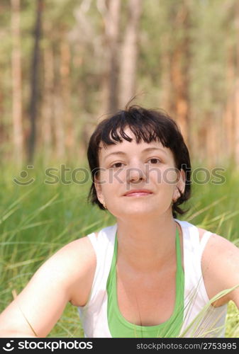 The girl and forest. Russian girl and green grass