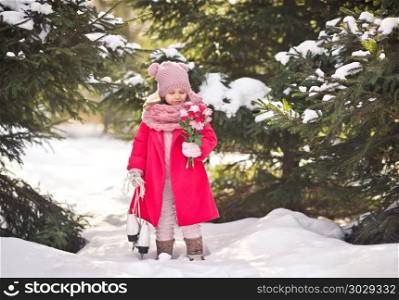 The girl carries a bouquet of flowers from the forest for her mother.. A little girl in a pink coat with a bouquet of flowers 917.. A little girl in a pink coat with a bouquet of flowers 917.