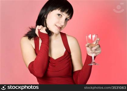 The girl in a red dress with a champagne glass