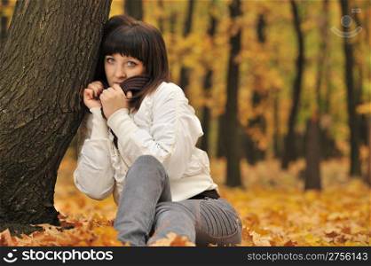 The girl in an autumn forest. The European appearance