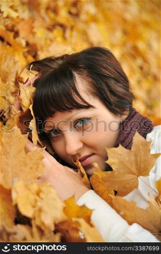 The girl in autumn leaves. The European appearance