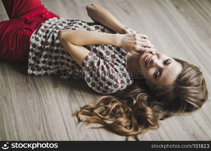 The girl in my dreams lying on the floor.. Portrait of a girl with hands in the mouth 6975.