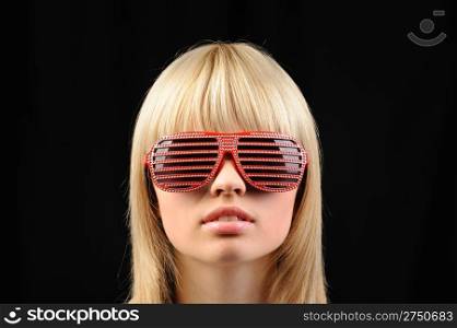 The girl in stylish sunglasses - jalousie. Red color